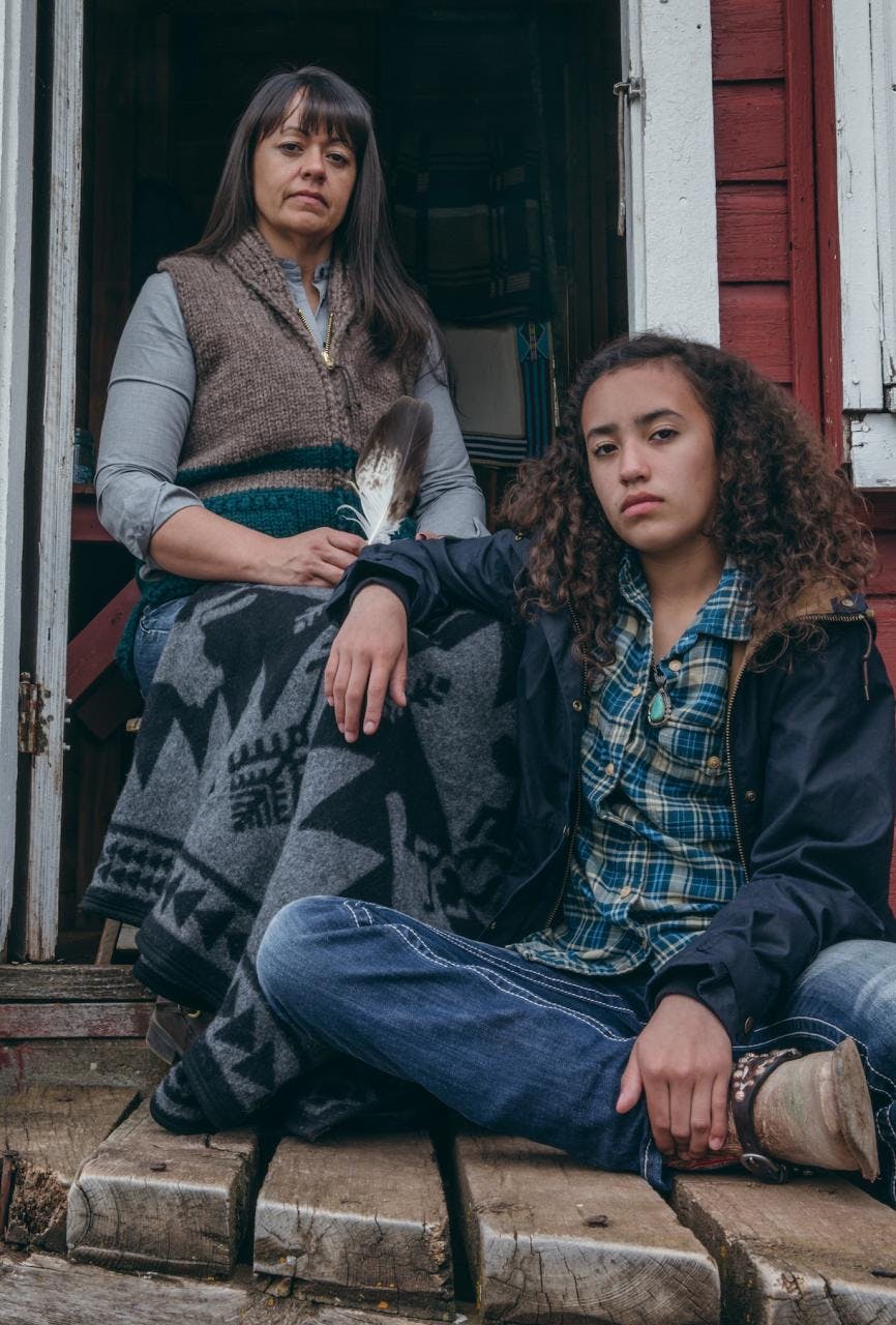 Jackie sitting on the porch with her daughter