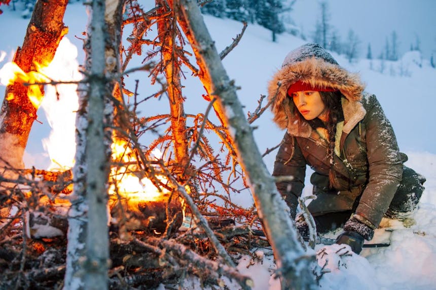 keya around a fire in snow