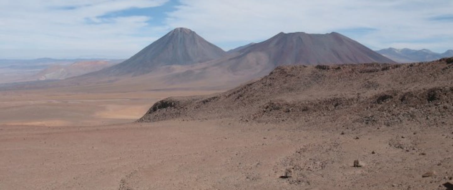stark high Andean desert with severe brown mountain peaks