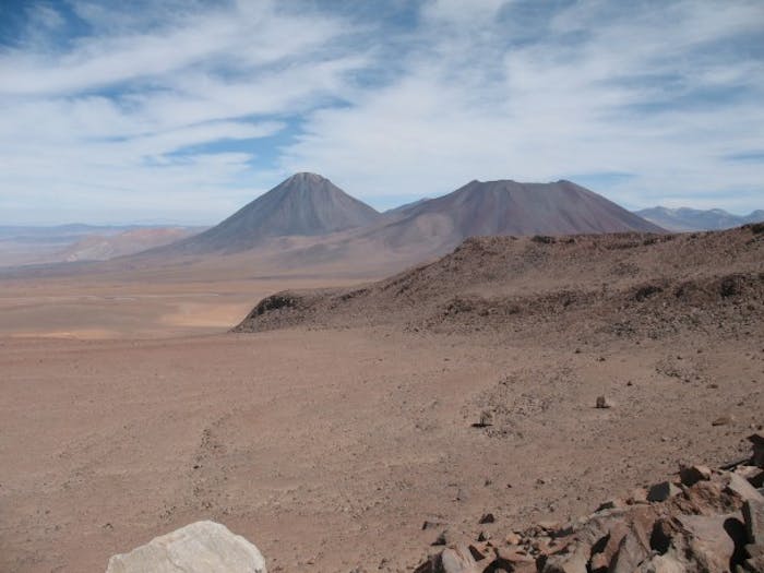 stark high Andean desert with severe brown mountain peaks