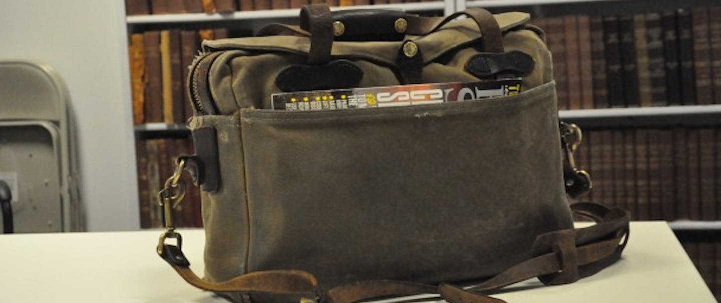 Filson Briefcase on table in library