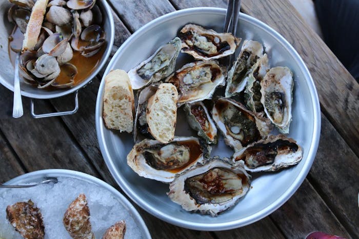 oysters and bread in bowls