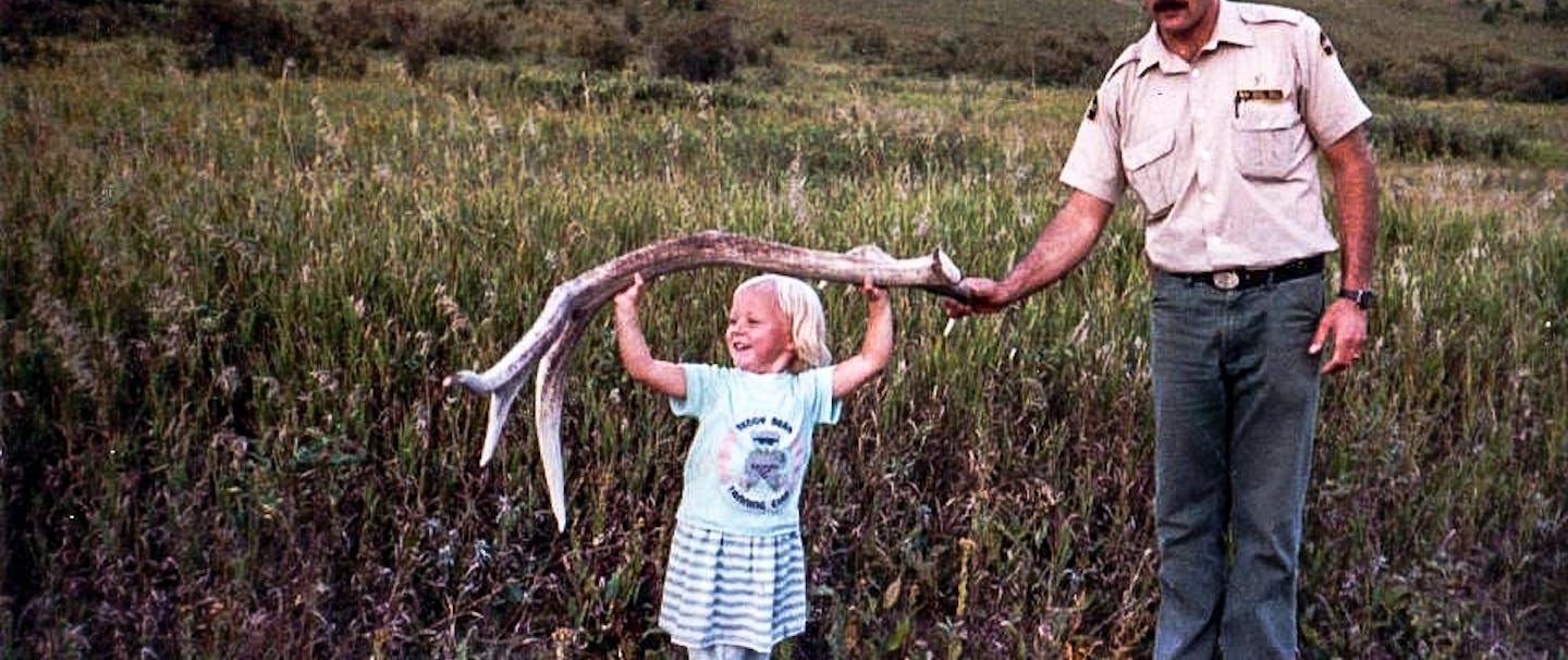 Filson Life - Jillian Lukiwski small daughter holds large elk antler with dad's help