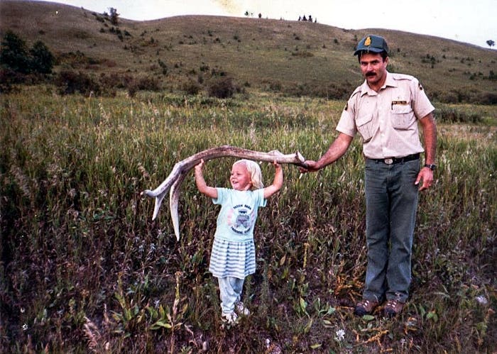 Filson Life - Jillian Lukiwski small daughter holds large elk antler with dad's help