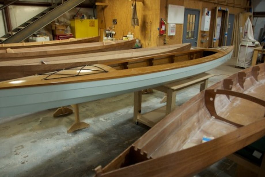 wooden canoes being built and finished