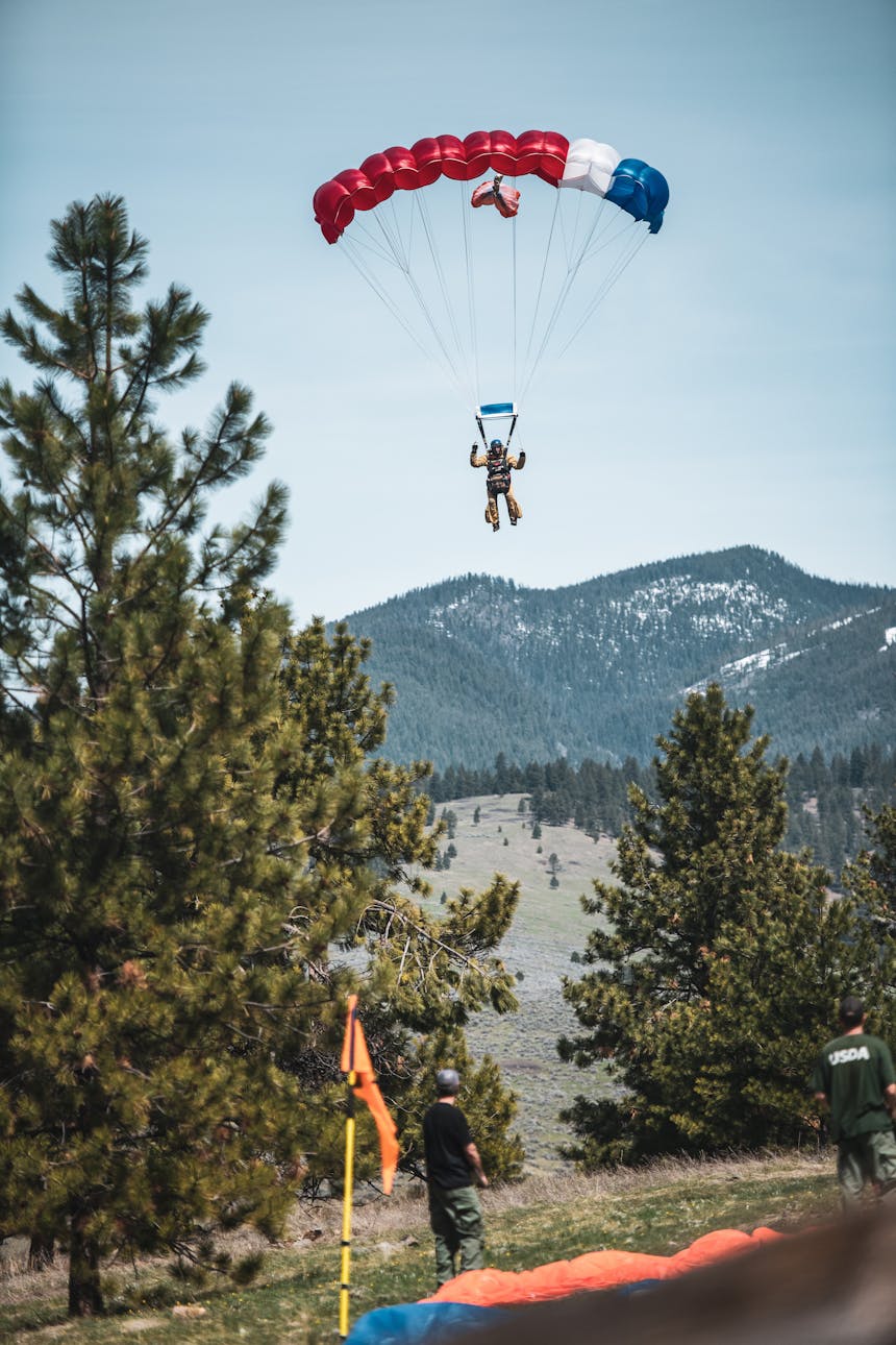 wildland firefighter parachuting to landing
