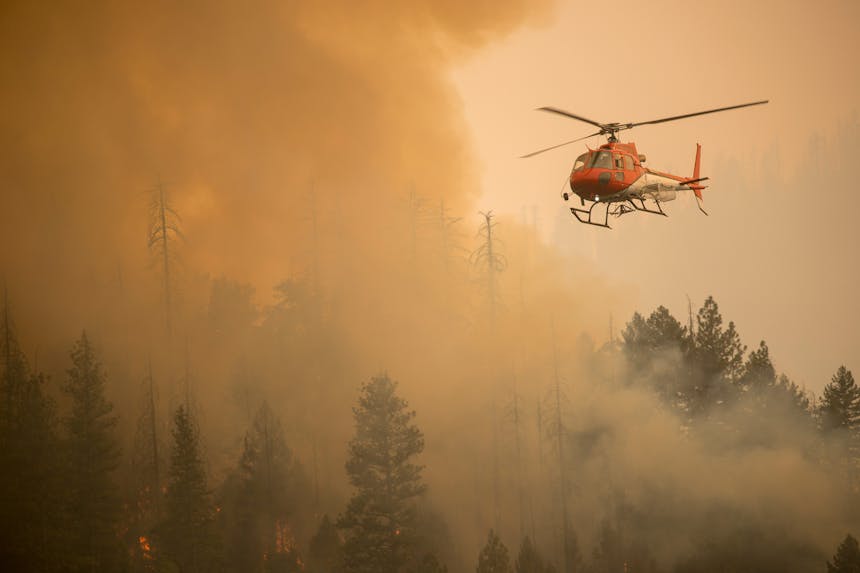 helicopter flying through fire