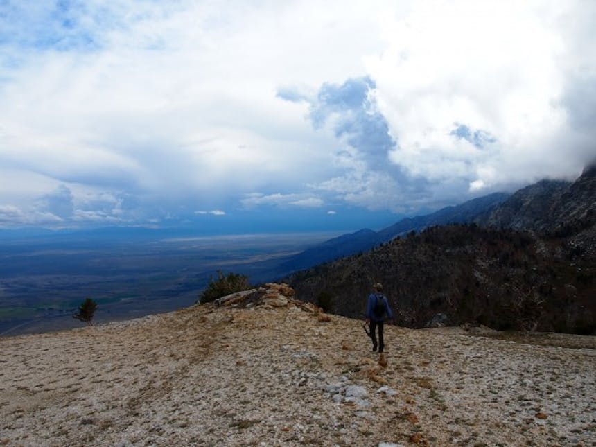 man walking towards ridge