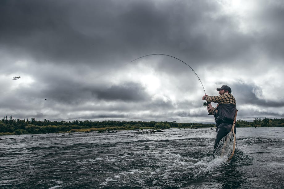 Alaska Fisherman reeling in fish