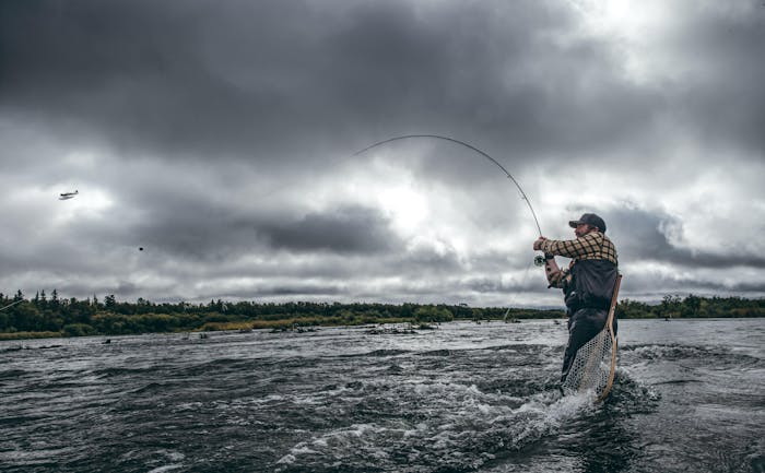 Alaska Fisherman reeling in fish