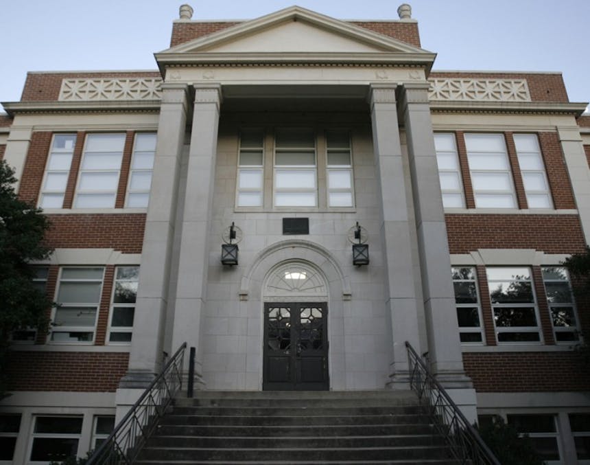 the exterior of The Warnell School of Forestry and Natural Resources building on University of Georgia's campus, a brown brick building with grey accents and entry