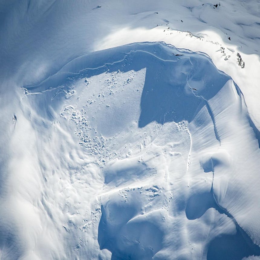 an areal view looking down of a swirl of snowpack