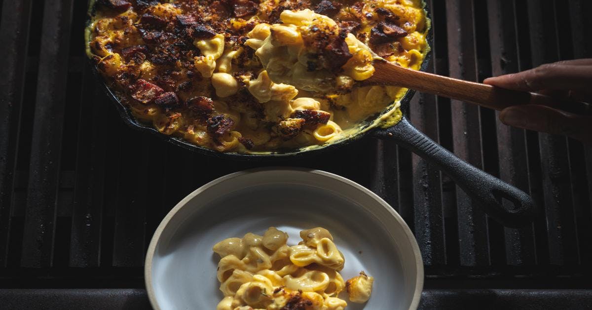 https://filson-life.imgix.net/2019/12/Fire-Baked-Mac-and-Cheese_Faded_18.jpg?fm=pjpg&ixlib=php-1.2.1