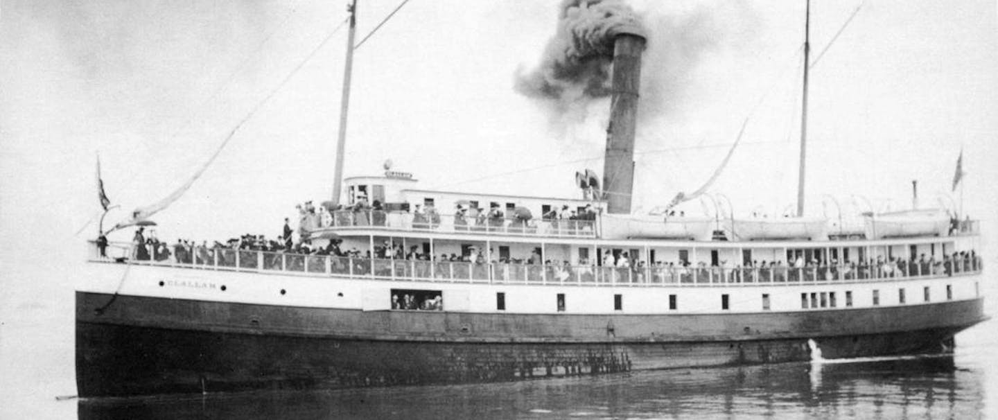 a black and white image of the bow of the SS Clallam with passengers prior to its sinking