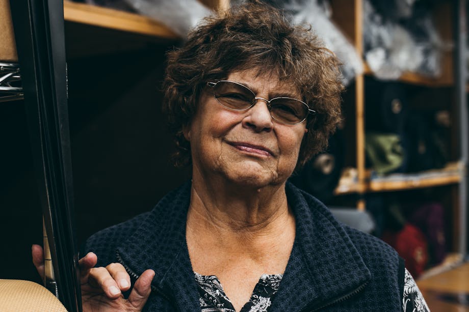 portrait of middle aged woman with tinted glasses in a fleece vest