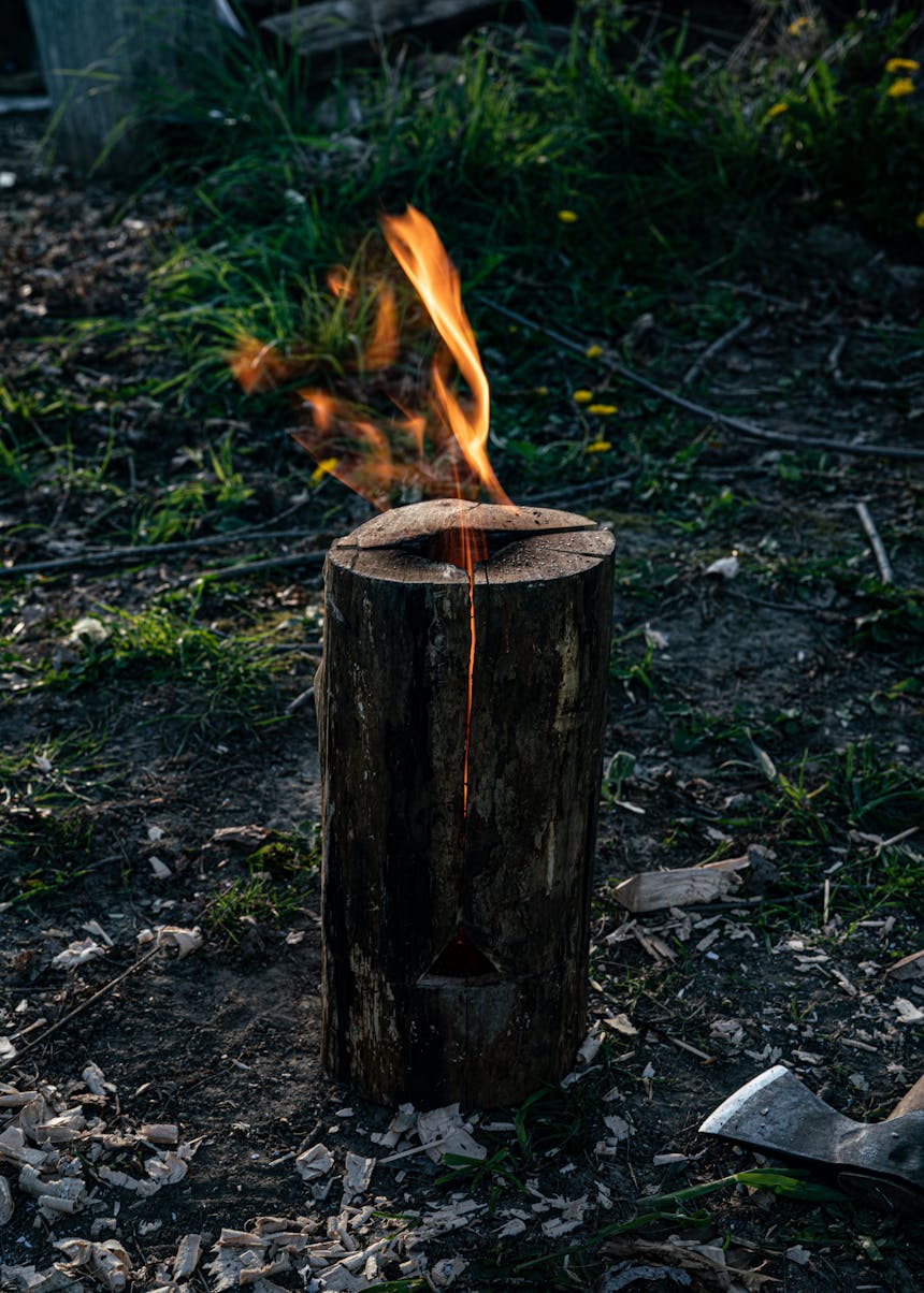 fire escaping the central hole of a rocket stove