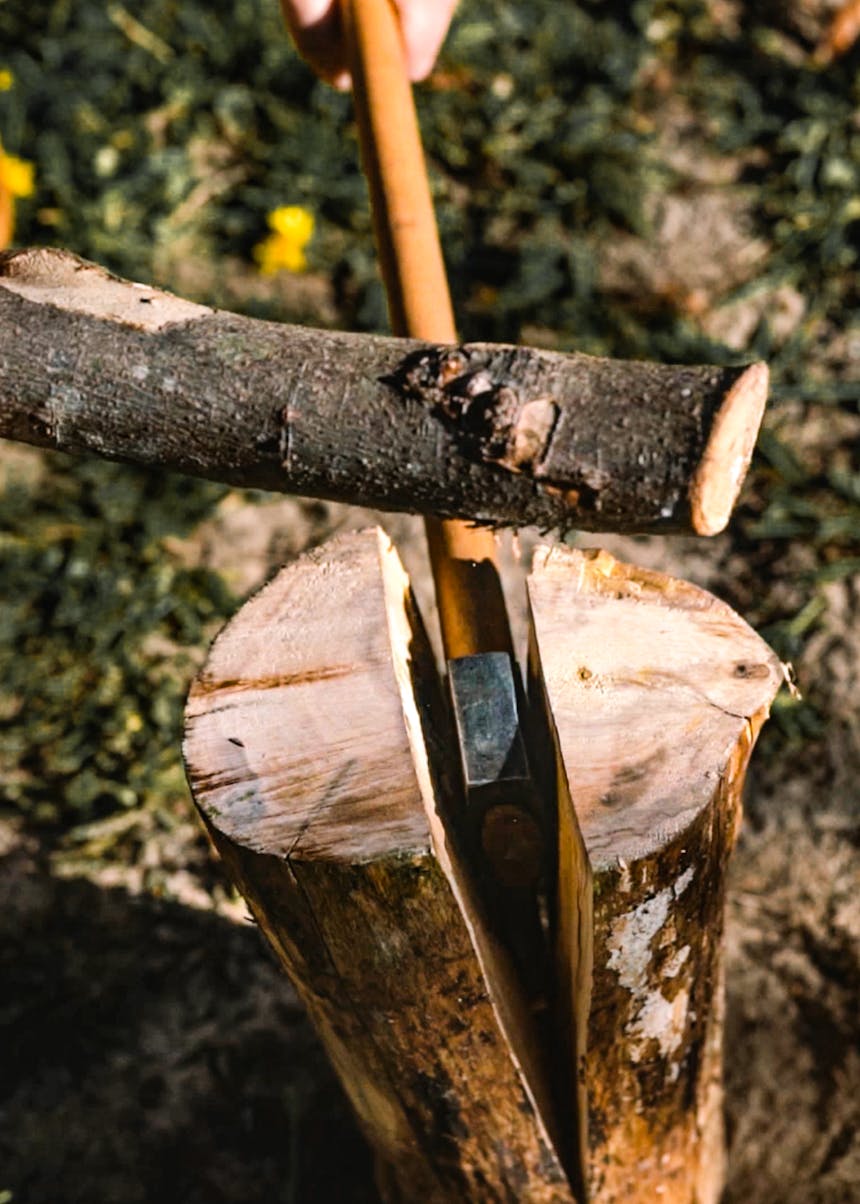 axe splitting a log down the center