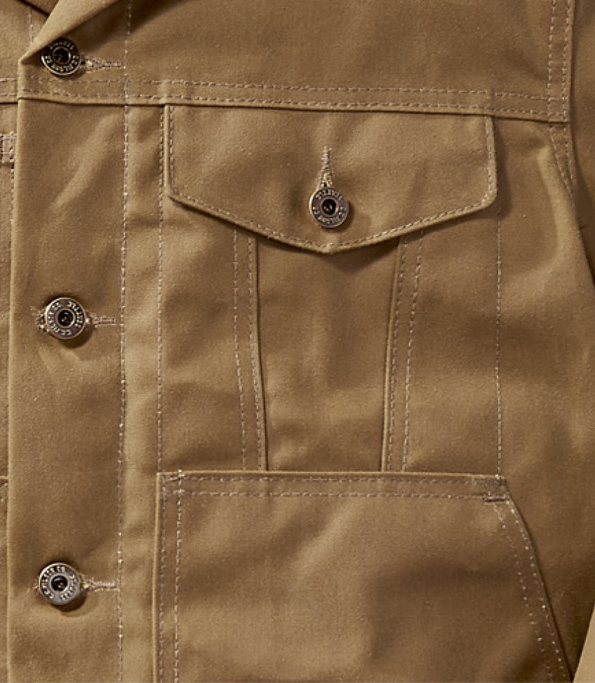 new wax cotton coat detail with filson buttons and pockets detailed
