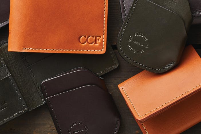 leather filson wallets and card protectors laid out on a table