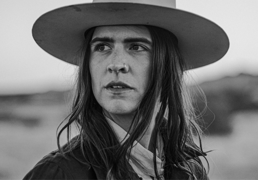 portrait of woman with nose ring and white cowboy hat