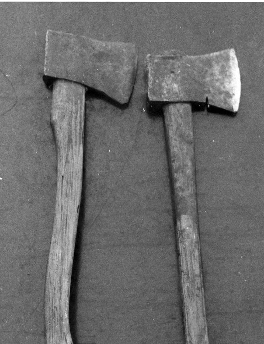 two axes with wooden handles