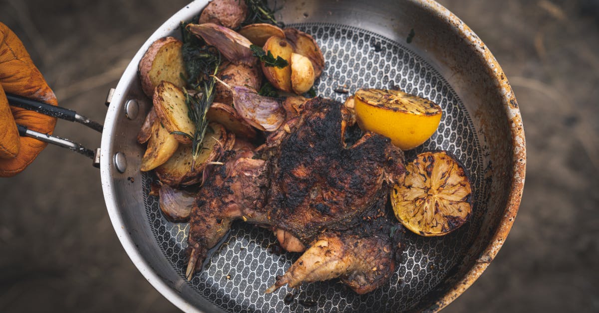 https://filson-life.imgix.net/2020/10/Chukar-Grilled-Over-Sagebrush_1200x628.png?fm=png&ixlib=php-1.2.1