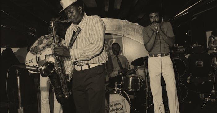black and white image of men playing in Band
