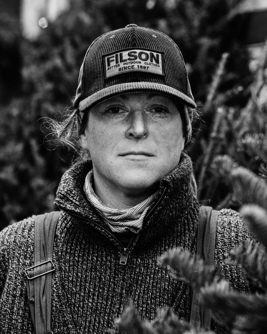 black and white portrait of emily mullen in a filson hat