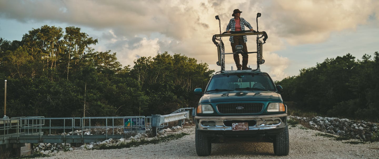Donna Kalil standing on top of her SUV's hunting platform.