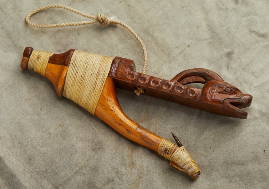 A wooden halibut hook, hand-crafted by Tlingit Master carver Jon Rowan of Klawock, Alaska.