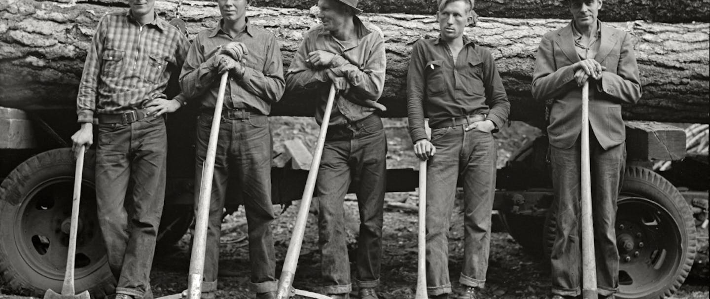 Black and white historical photo of five men wearing White's Boots.