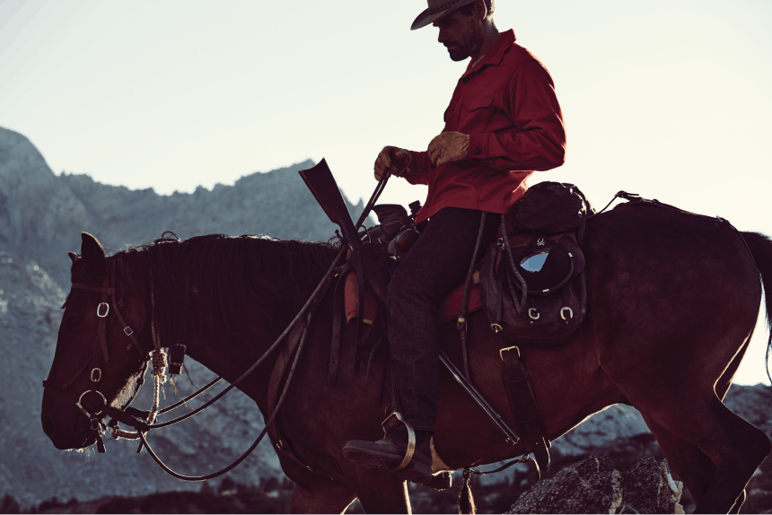 Man riding horse on peak top in California