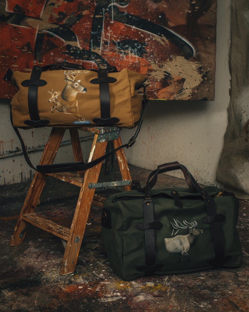 Filson bags in front of artistic backdrop