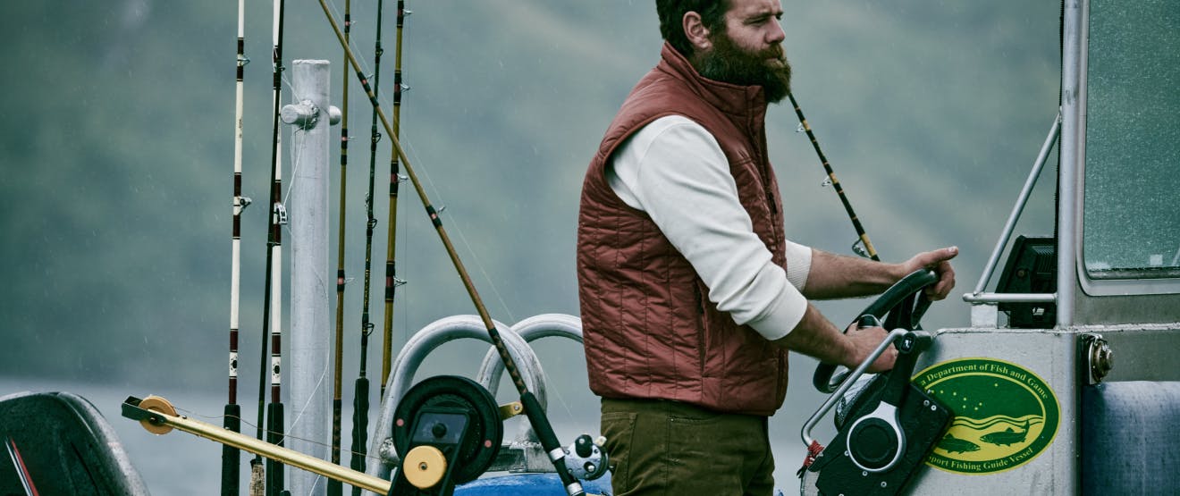 Fisherman wearing Filson vest