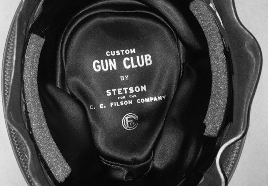 black and white close up of the inside of a stetson cowboy hat, reading: custom gun club by stetson for the cc filson company
