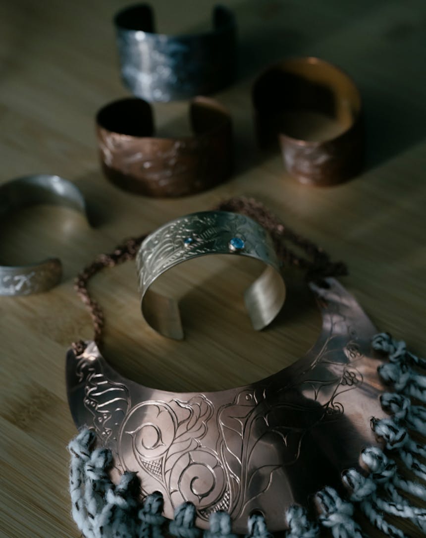 Mary's Copper Jewelry on a table