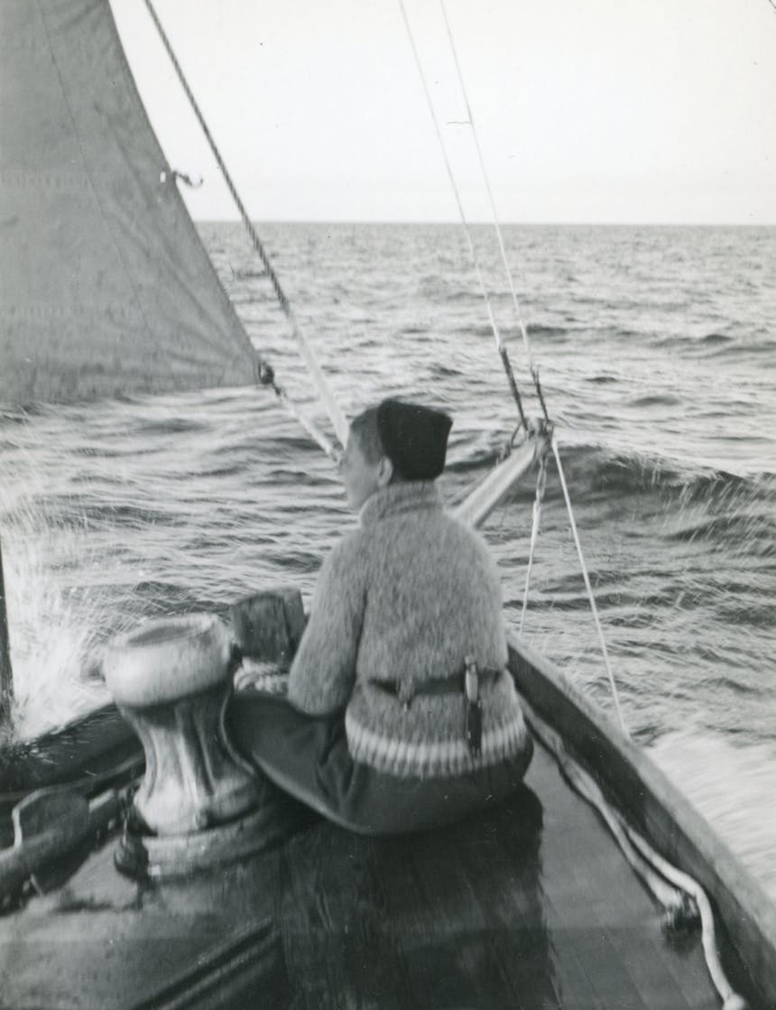 Boy on the bow of a boat