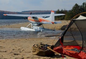 A Cessna and Filson duffle in camp