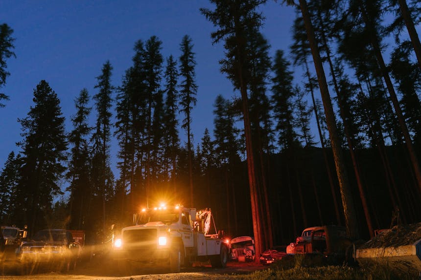 tow truck with lights on at night