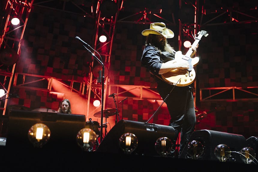 Chris Stapelton on stage playing electric guitar