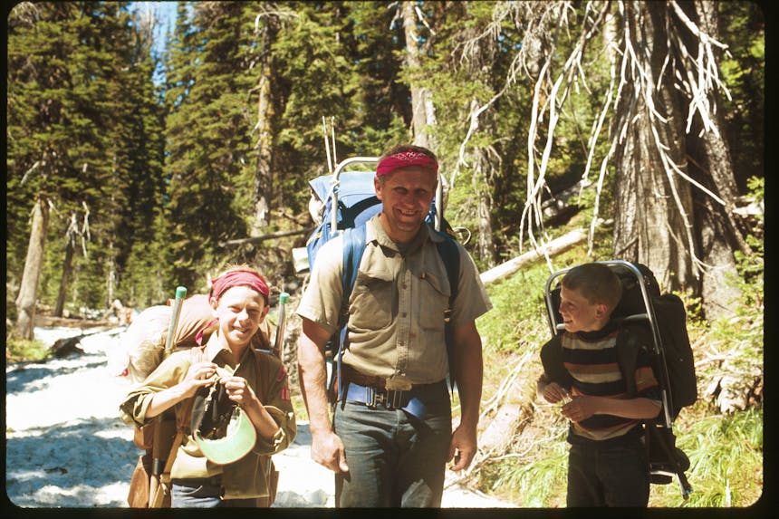 Poz with scouts walking through forest