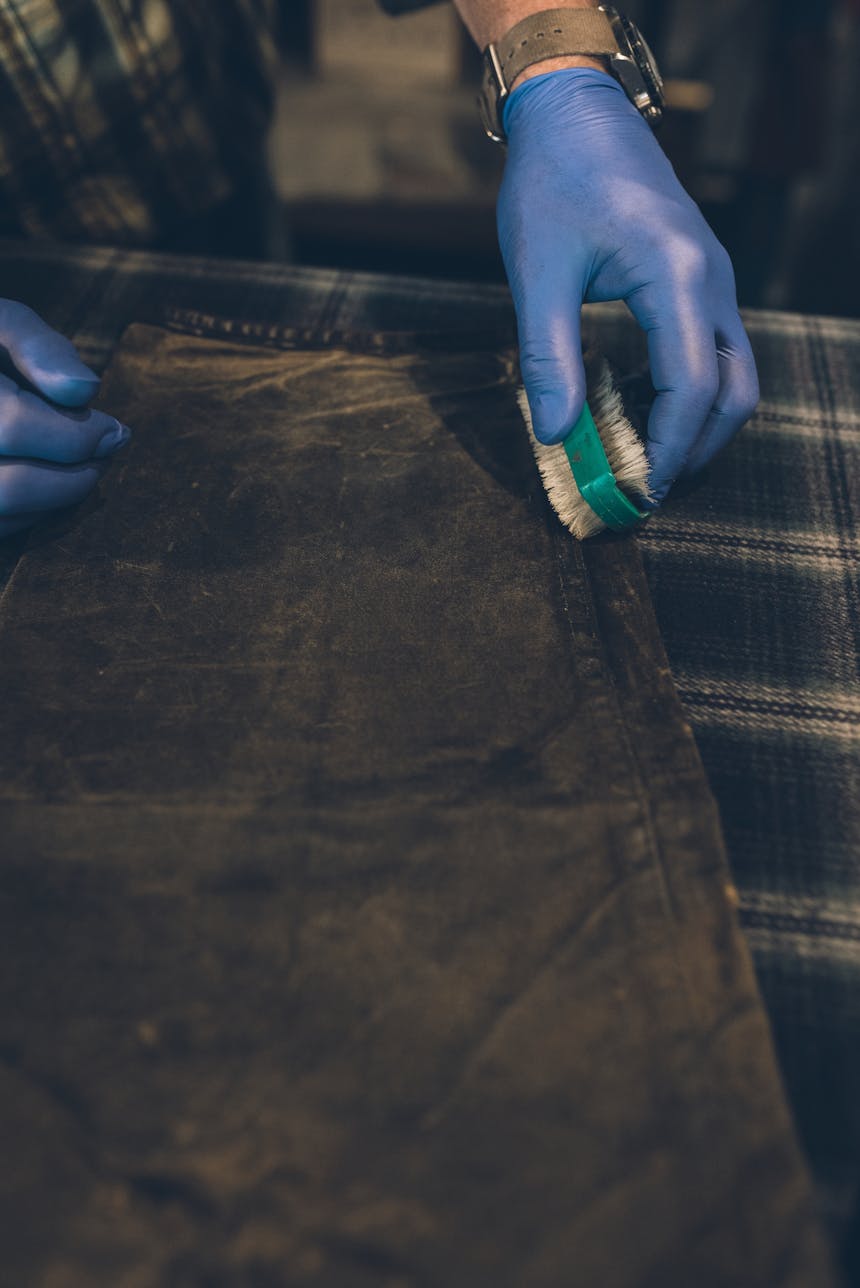 brushing seams of re-oiled jacket